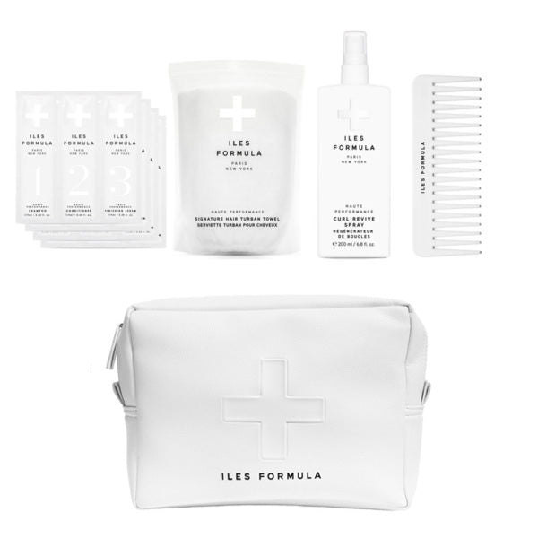 Iles Formula hair care products including packets, a pouch, and a bottle on a white background